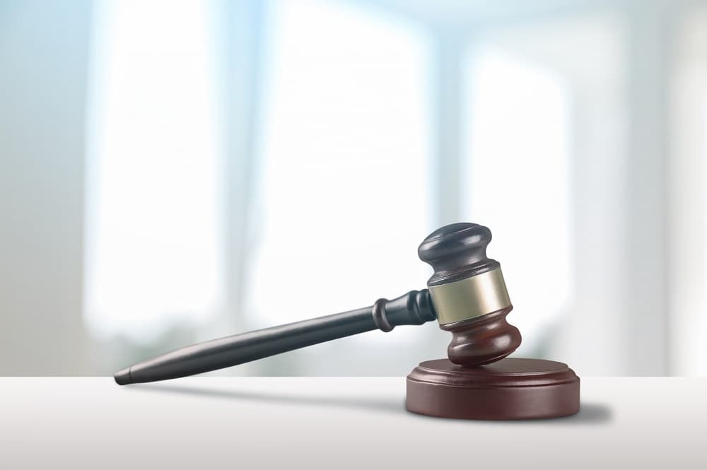 Justice Scales and books and wooden gavel on table. Justice concept