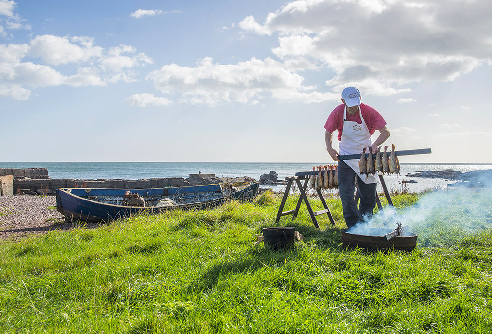 Arbroath Smokies Being Prepared on The Beach At Auchmithie